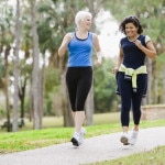 Friends Power Walking in Park --- Image by © Kevin Dodge/Corbis