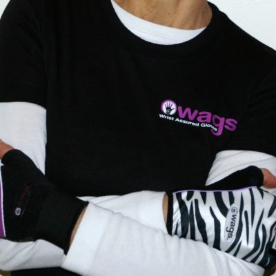 An image of someone wearing two different fitness WAGs gloves that help you deal with wrist pain